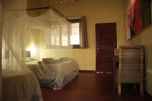 An image of the bedroom at Olga's guest house, one of the cheapest hotels in Victoria Falls
