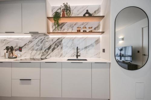 Bow Lane by Aeria Apartments - Tap to explore photos