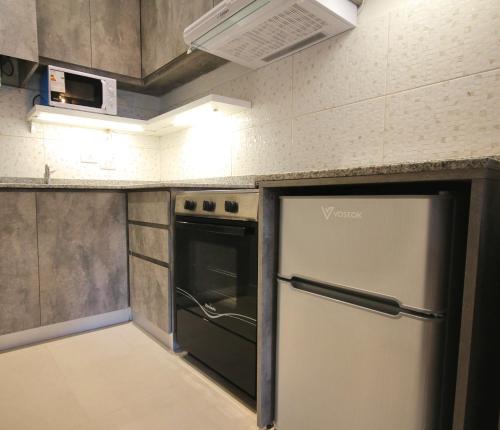 Huellas Boutique Apartments - 주방
