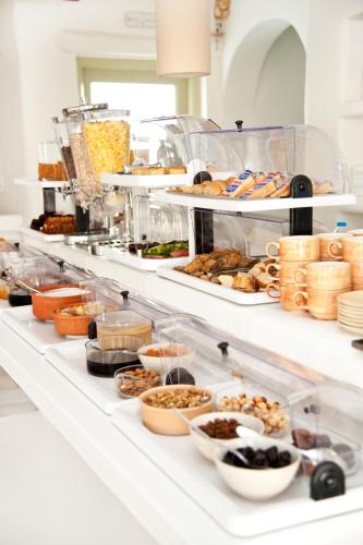ห้องส่วนกลางสำหรับนั่งเล่น/ดูทีวี, Altana Boutique Hotel in ไทโนซ