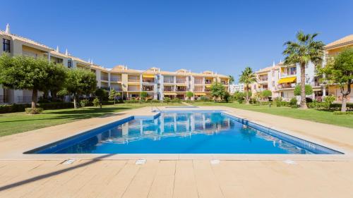 Serene Apartment W/ Balcony and Pool by LovelyStay