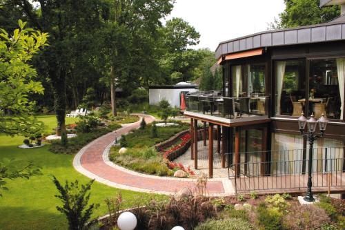 Зовнішній вигляд готелю, Golf- und Wellnesshotel Amtsheide in Бад Бевенсен