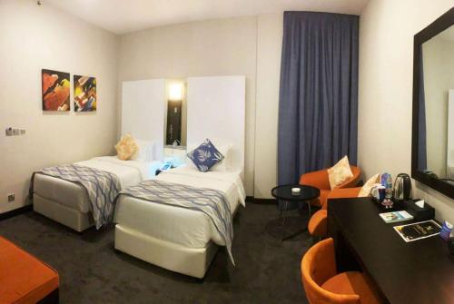 Deluxe Room Twin room in Ramada Encore by Wyndham Doha