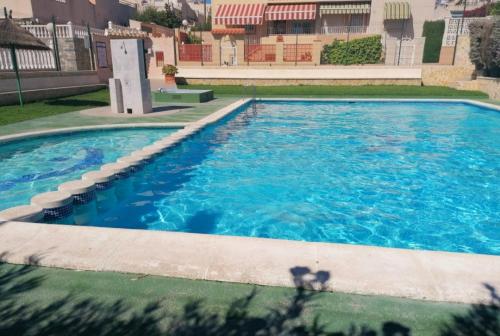 Apartament Casa del Gato Rojo , communal swimming pool , terrace with barbecue