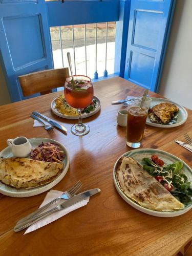 Flor de León Café - Hostal