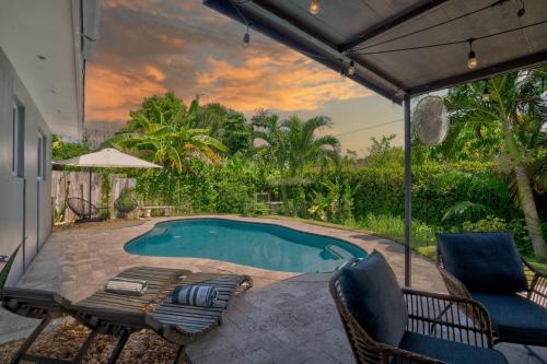 Tropical Getaway with Pool & Charming Backyard Sleeps 8