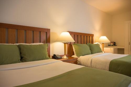 Deluxe Quadruple Room room in Grand Coastal Hotel