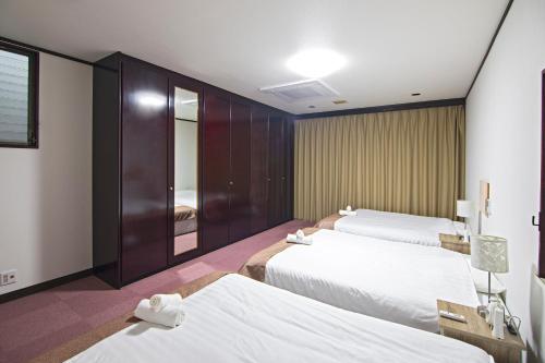 ゲストハウスカンパイ〜広々と明るい大人数向け〜今里エリア Room Type - Two-Bedroom Villa