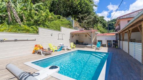 Úszómedence, Alpinia - Appt avec piscine partagée (Alpinia - Appt avec piscine partagee) in Saint-Pierre