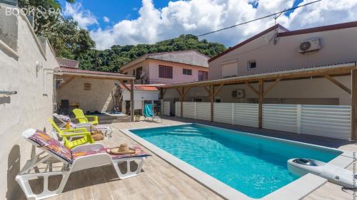 Úszómedence, Alpinia - Appt avec piscine partagée (Alpinia - Appt avec piscine partagee) in Saint-Pierre