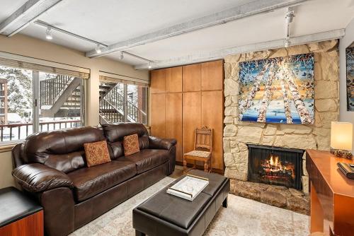 Silverglo Condominiums Unit 202, Upgraded Condo with Wood-Burning Fireplace and Access to a Pool