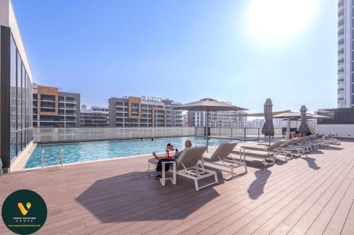 Swimming pool, Vogue Sobha Hartland lush oasis near Downtown in Nad Al Sheba