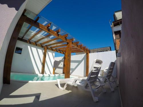 Residencial Viva Torres- Casas Privativas c 2 dorm, Sala e Cozinha Completa com Piscina Térmica Compartilhada na Praia da Cal
