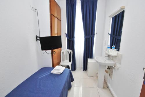 Habitación individual, baño compartido