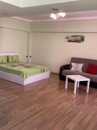 One-Bedroom Apartment with Balcony and City View
