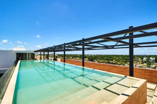 Opulent Apartment in Tulum With Private Balcony, Rooftop Pool, Gym and Chic Amenities