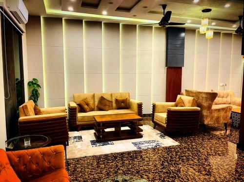 Shared lounge/TV area, Swat Hilton Hotel by Khan Familia Travels in Mingora
