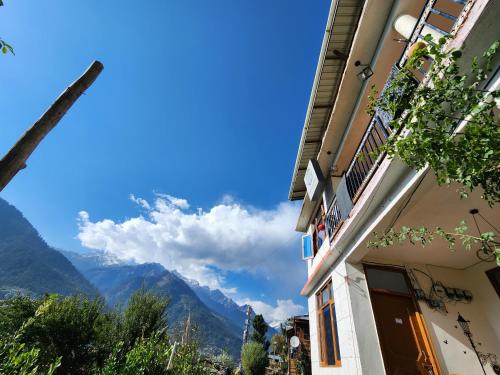 Safarnama Stays Manali - Rooms with Snow Peaked Mountain View