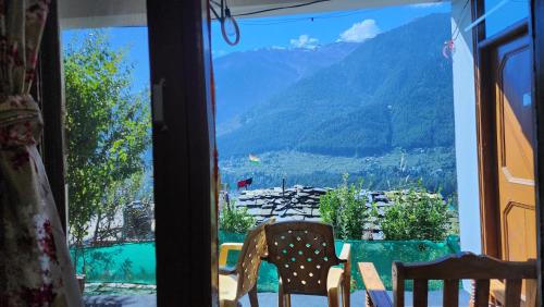 Safarnama Stays Manali - Rooms with Snow Peaked Mountain View