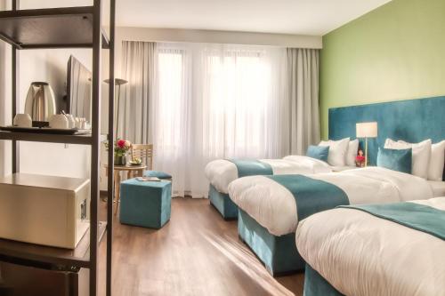 Standard Triple Room room in The Liwan Hotel