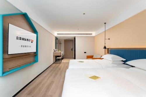Deluxe Twin Room room in Yilin Chengji Hotel - Guangzhou Baiyun Station International Branch