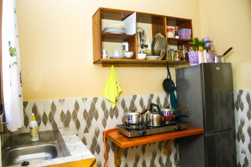 Kitchen, Margareth's Home Stay Free Wi-Fi and Tv in Tanga