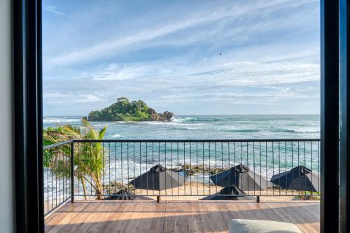 Deluxe Double Room with Side Sea View room in Abode By The Beach