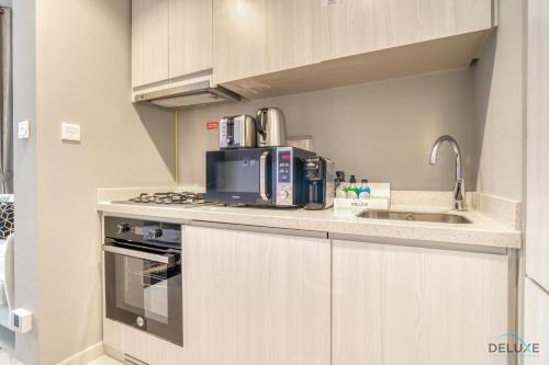 Limited Time Offer Modern 1BR at DAMAC Zada Tower by Deluxe Holiday Homes, Dubaï (photo 4)