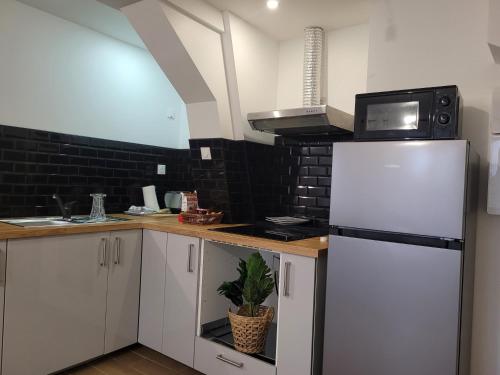 кухня, Coquet appartement à 15mn de Paris et 10 mn de Stade de France, wifi, Netflix, (Coquet appartement a 15mn de Paris et 10 mn de Stade de France, wifi, Netflix,) in Сан-Бріс-су-Форе