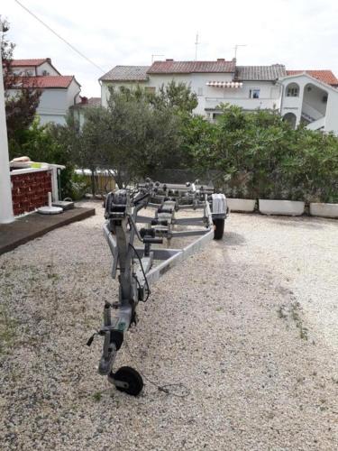 lovely apartments near the town of Rab with Children's pool, playground, garden, parking lot, grill, terraces,