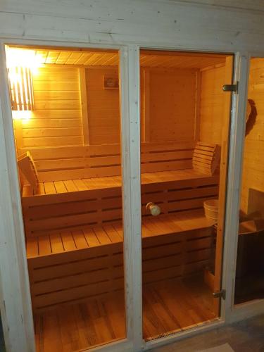 Idyllisches-Blockbohlenhaus-mit-eigenem-Garten-und-Sauna-zum-Wohlfuehlen in Rastorf