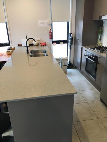 Kitchen, A Private Ensuite with AC and TV in South Western Sydney