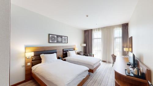 Premier Twin Room with Complimentary Water, Free WiFi, Free Tea and Coffee Equipment