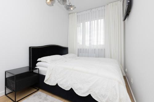 Stylish Apartment Przedpole with Balcony & Parking by Noclegi Renters, Warsaw