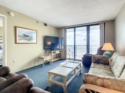 Ocean View with a beachfront pool at Ocean Trillium Condo 504 in New Smyrna Beach, USA
