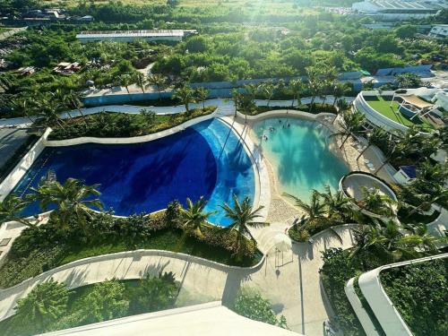 1 Bedroom - The Bali Getaway Azure North by THE BALI CORNER AT AZURE NORTH, High Floor, Big Balcony with Full View of Beach Resort Amenities, San Fernando (Foto 7)