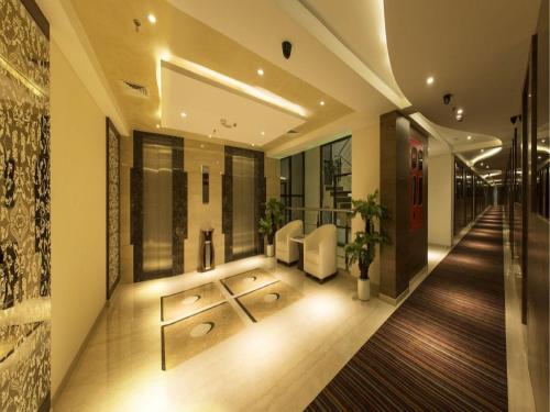 Shared lounge/TV area, The President Hotel in Hubli