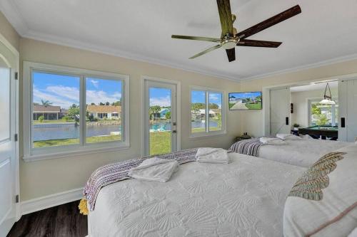 NEW Stunning Delray Waterfront Oasis - Heated Pool, Spa, Canal, Dock, Huge Patio, Pool Table!