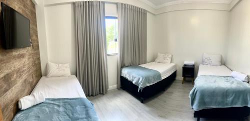 Apartamentos em Vicente Pires Room Type - Standard Triple Room
