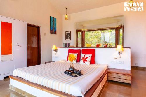 StayVista's House Below The Hill - A stylish Mountain-view villa with Pool and Games room