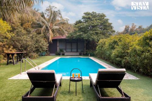 StayVista's Moonlit Trails - Pool-View Villa with Turf Near Mandwa Jetty