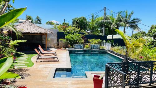 Charmant rez de jardin avec acces piscine - Location saisonnière - Le Tampon