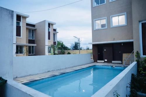 2BHK leisure home near Auroville featuring a shared community pool in Kilpettai