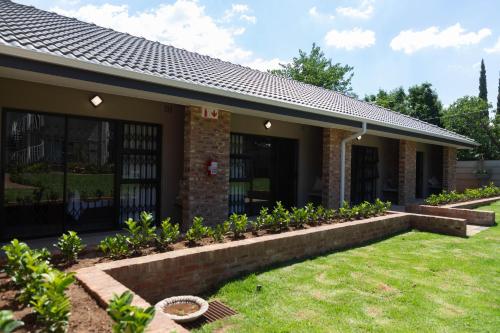 Kert, Opstal Gastehuis in Baillie Park
