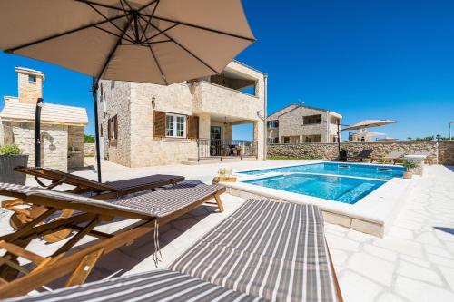 New stone villa with pool near the sandy beach by Traveler tourist agency Krk ID 2372 br 1