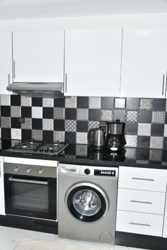 Kitchen, Stylish 3-Bedroom Flat in Kenitra Center Ville with Parking & Comfort in Kenitra