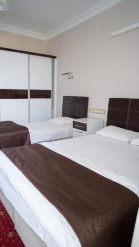 Chambre avec 2 lits, vue sur le lac