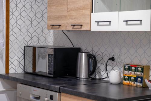 virtuve, CityOasis Apartment in Nowe Miasto Lubawskie