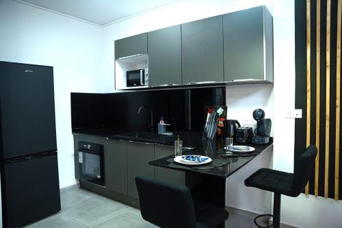 Facilities, L'elegance Citadine - T2 55m2, salon climatise pres de McDonald in Cayenne
