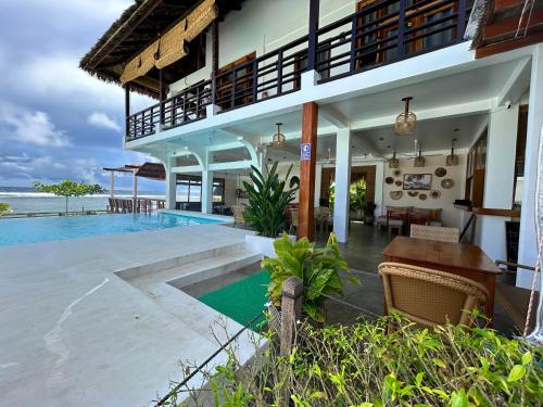 Swimming pool, Yapak Beach Villas in San Isidro